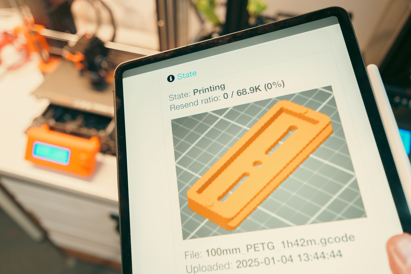3d print slice software remote control tablet hand holding device prototype model on screen